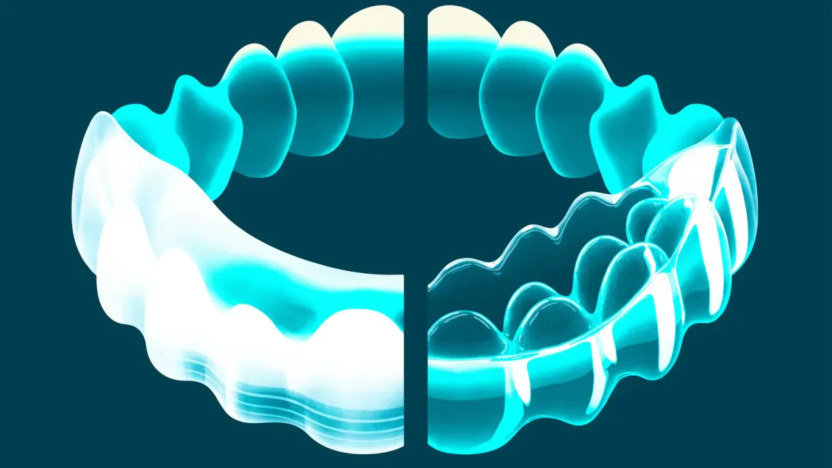 Side-by-side of Invisalign and ClearCorrect clear aligner trays on a dental model